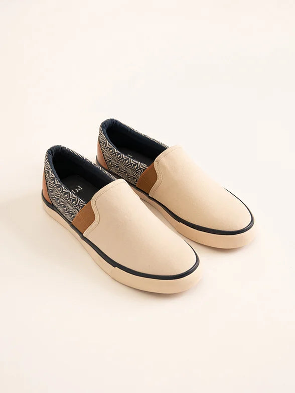 Men's loafers with a tassel front for a classic lookAFRICAN PRINT SLIP ON SNEAKER - STONE